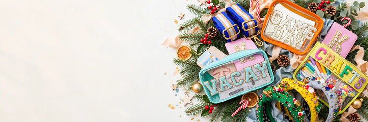 Personalized patch pouches, bag straps and festive headbands among pine branches and ornaments
